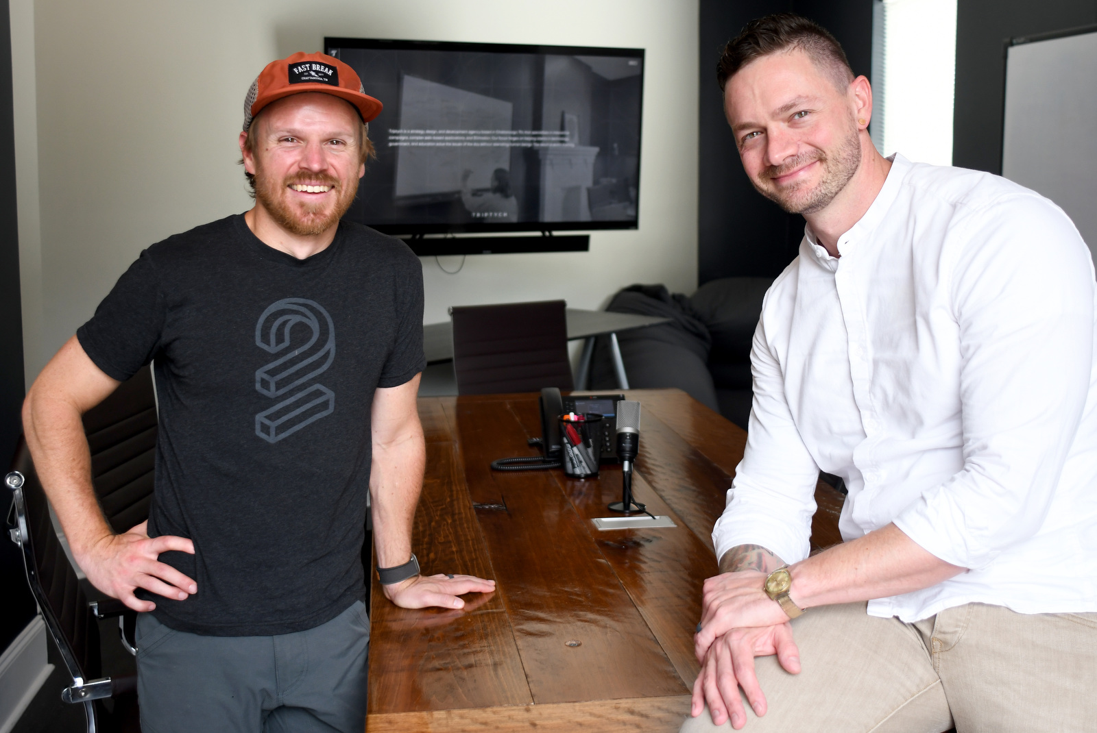 Staff Photo by Robin Rudd / Triptych Chief Technical Officer Tyler Johnson, left, and Chief Strategy Officer C. Elliott Johnston are seen at the company's Georgia Avenue offices on Aug. 8.