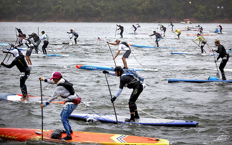 Staff file photo / Racers take off from the start for the Chattajack paddling race at Ross's Landing. Racers travel 31 miles along the Tennessee River from Ross's Landing to Hales Bar Marina near Nickajack Lake.