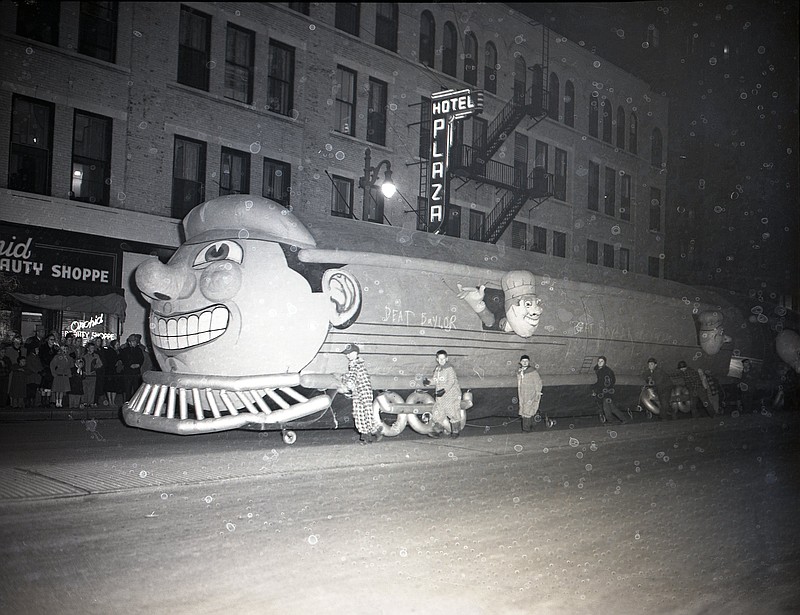 News-Free Press file photo via ChattanoogaHistory.com / The 1950 downtown Chattanooga Christmas parade is said to have attracted 50,000 people. The inflatable train, shown here, was one of a score of balloon features in the event, which was called the Retail Merchants Association Christmas Parade.