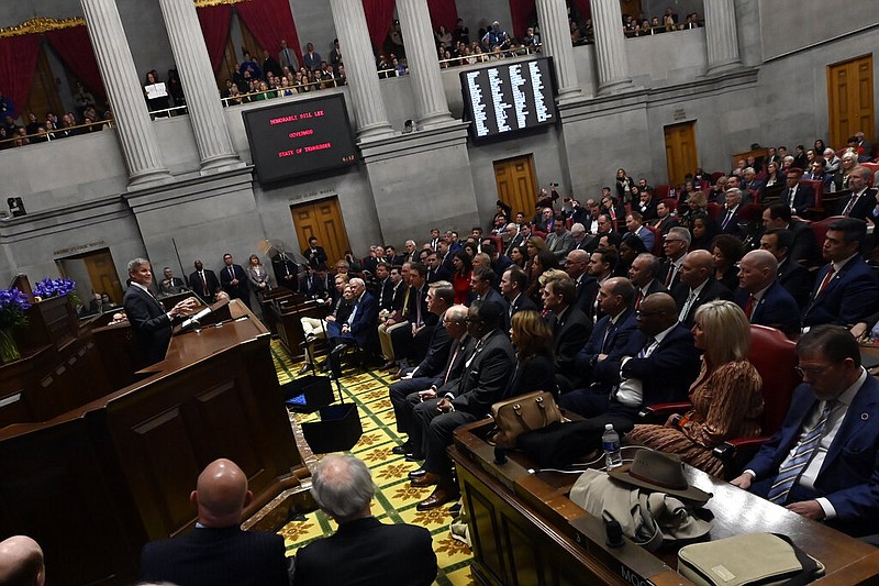 Tennessee Gov. Bill Lee, left, delivers his State of the State Address in the House Chamber, Monday, Feb. 6, 2023, in Nashville, Tenn. (AP Photo/Mark Zaleski)