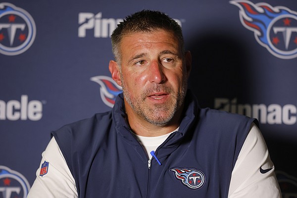 Tennessee Titans coach Mike Vrabel walks out of Friday's press