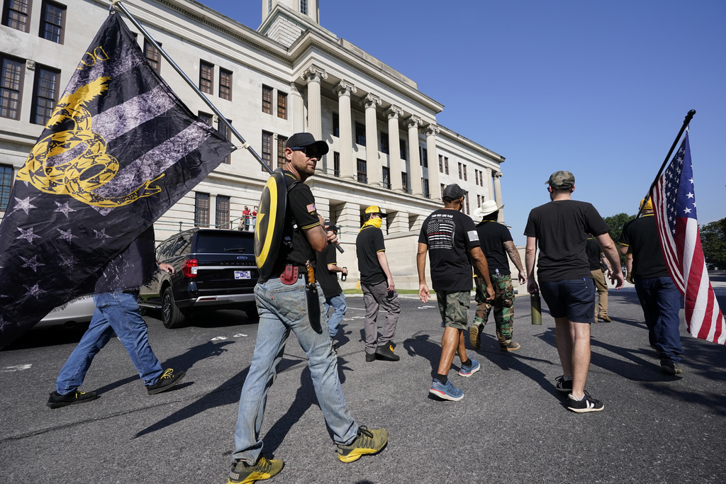 Members of the Proud Boys walk around the State Capitol before a special session of the state legislature on public safety Monday, Aug. 21, 2023, in Nashville, Tenn. (AP Photo/George Walker IV)