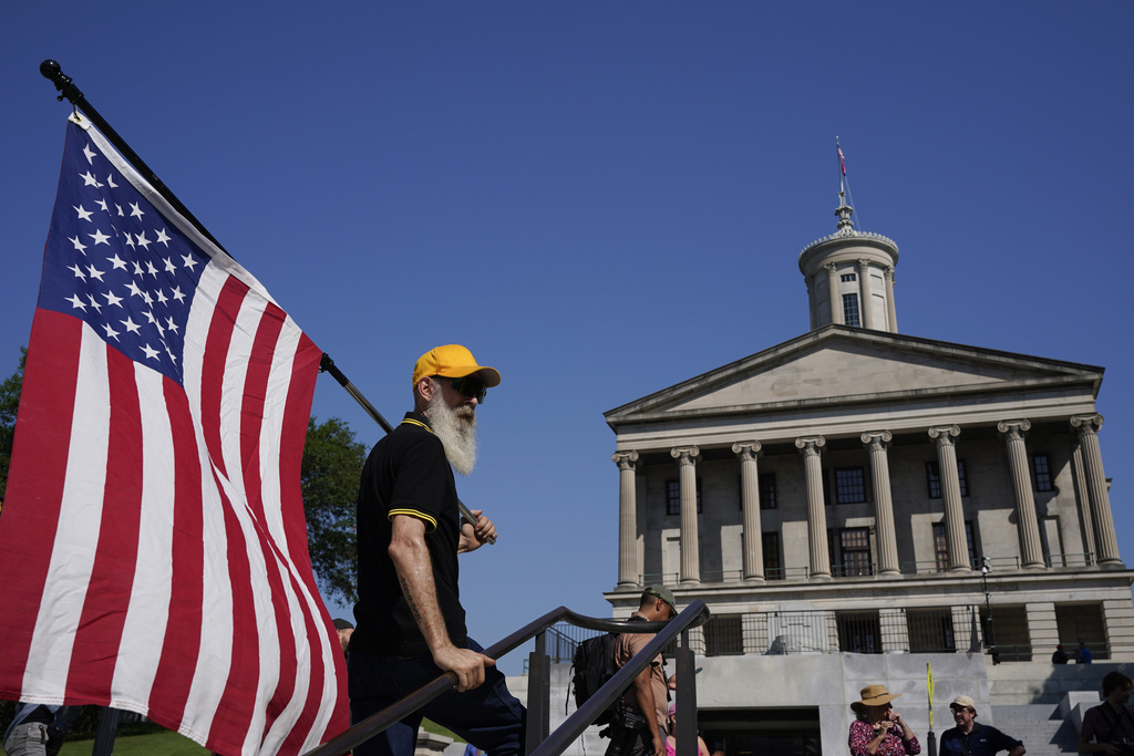 A member of the Proud Boys stands below the State Capitol before a special session of the state legislature on public safety Monday, Aug. 21, 2023, in Nashville, Tenn. (AP Photo/George Walker IV)