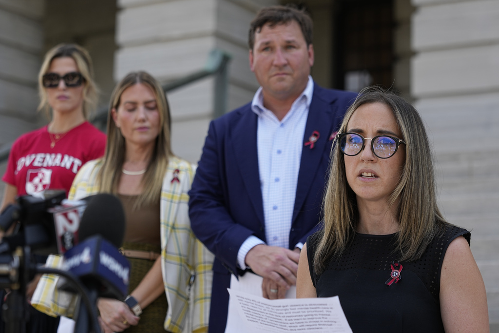 Sarah Shoop Neumann, right, a parent of a Covenant School student and member of Covenant Families Action Fund delivers remarks during a news conference before a special session of the state legislature on public safety Monday, Aug. 21, 2023, in Nashville, Tenn. (AP Photo/George Walker IV)