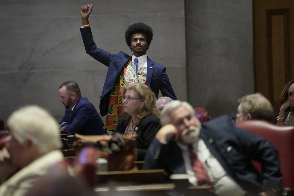 Rep. Justin J. Pearson, D-Memphis, raises his fist to acknowledge people in the gallery during a special session of the state legislature, Monday, Aug. 21, 2023, in Nashville, Tenn. (AP Photo/George Walker IV)