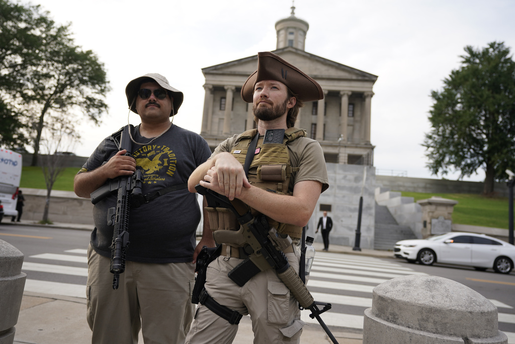 Josiah Maldonado, left, and Shaun Kranich, of the group Tennefree, carry rifles outside the state Capitol after a special session of the state legislature Monday, Aug. 21, 2023, in Nashville, Tenn. Deeply divided Tennessee lawmakers returned to the state Capitol Monday, kicking off a special session that many hoped would address the state's relaxed gun laws but instead quickly devolved into bitter fighting over procedural rules and limits on public access into the building. (AP Photo/George Walker IV)