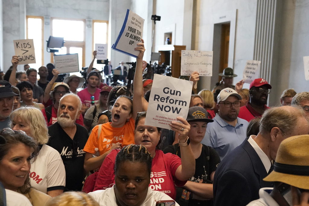 Demonstrators yell for gun reform laws in the lobby outside the legislative chambers of the state Capitol before a special session of the legislature Monday, Aug. 21, 2023, in Nashville, Tenn. (AP Photo/George Walker IV)