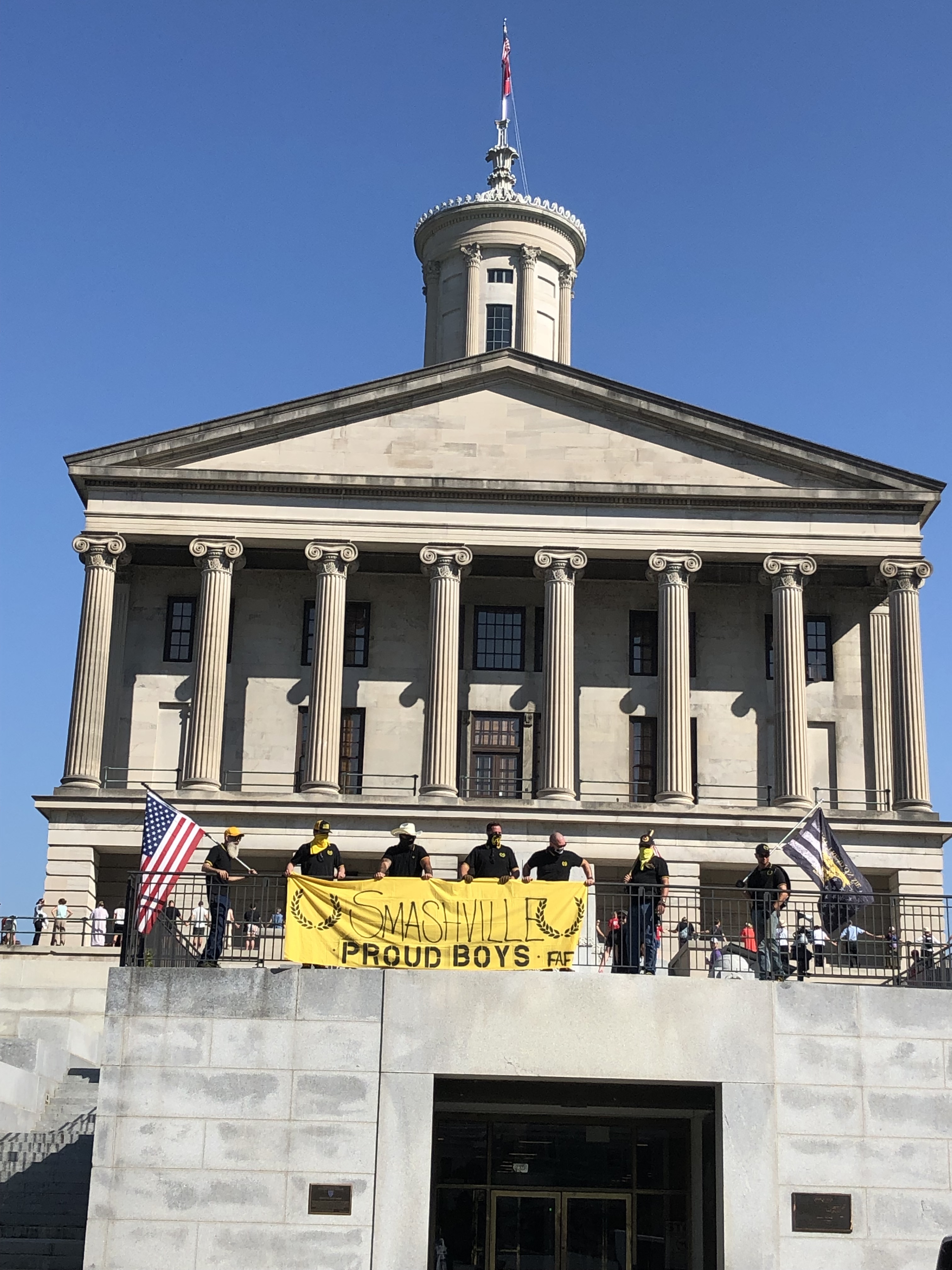 Staff Photo by Andy Sher / Members of the Proud Boys unfurl a banner Monday at the Tennessee Capitol prior to the start of the Tennessee legislatures special session on public safety.