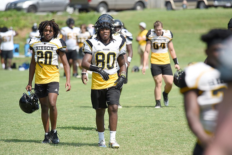 Staff photo by Matt Hamilton/ Hixson High School football players return to the field after a water break during the first day of practice in pads on July 24. The season kicked off last week.
