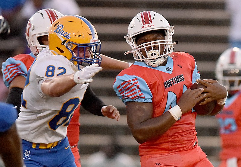 Staff photo by Matt Hamilton/ Boyd Buchanan's Brayden Standefer closes in on Brainerd ball carrier Michael Brooks during Friday night's game at Brainerd. The visiting Buccaneers won 31-0, improving to 2-0 with their second shutout of the season.