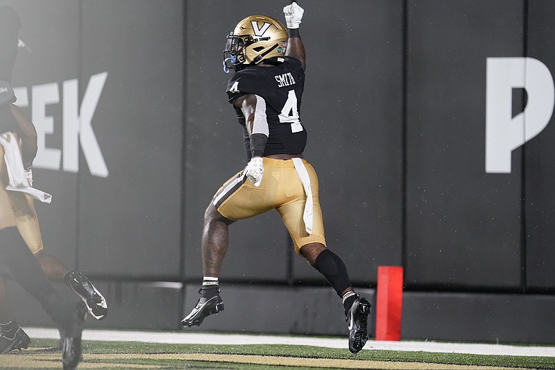 AP photo by George Walker IV / Vanderbilt running back Patrick Smith celebrates after his 21-yard touchdown run against Hawaii in the first half of Saturday night's season opener in Nashville.
