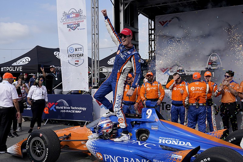 AP photo by Jeff Roberson / Chip Ganassi Racing driver Scott Dixon celebrates after winning Sunday's IndyCar race at World Wide Technology Raceway in Madison, Ill.