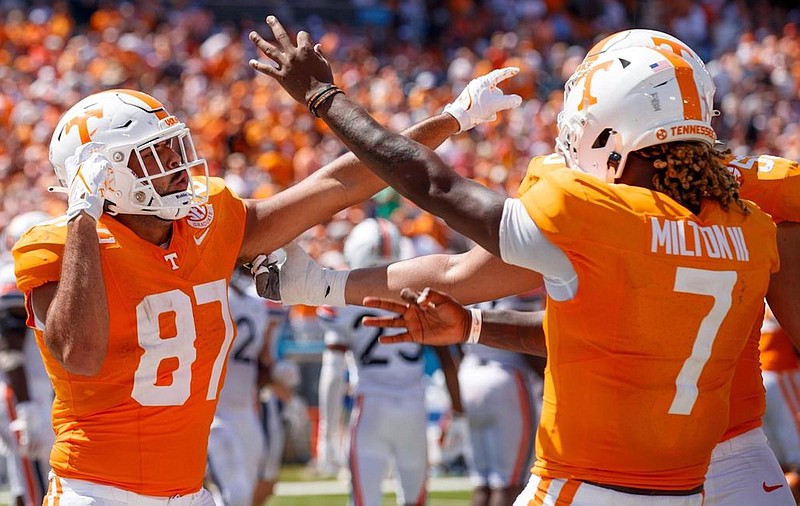 Tennessee Athletics photo by Kate Luffman / Tennessee tight end Jacob Warren, left, and quarterback Joe Milton III celebrate Milton's 11-yard touchdown pass to Warren early in the fourth quarter of Saturday's 49-13 rout of Virginia in Nashville.