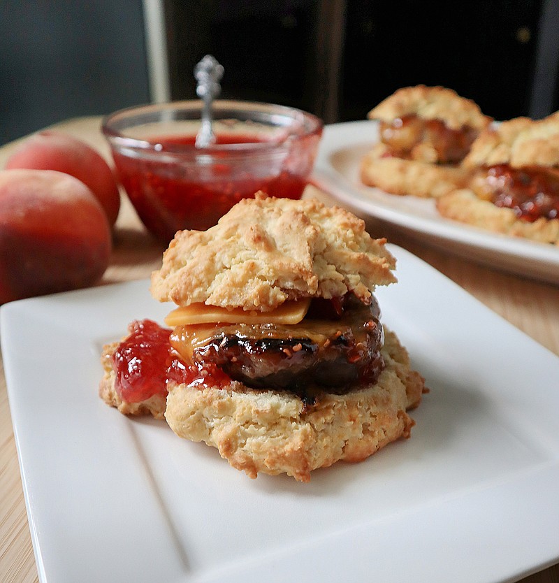 Start the day off right with a homemade sausage biscuit topped with refrigerator raspberry-peach jam. / Gretchen McKay/Pittsburgh Post-Gazette/TNS