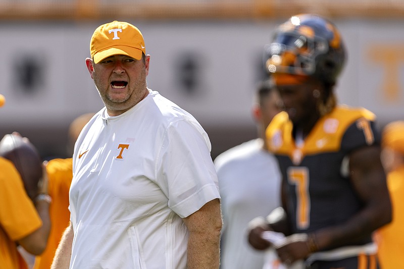 AP photo by Wade Payne / Tennessee football coach Josh Heupel yells to his players as they warm up for Saturday's home game against Austin Peay.