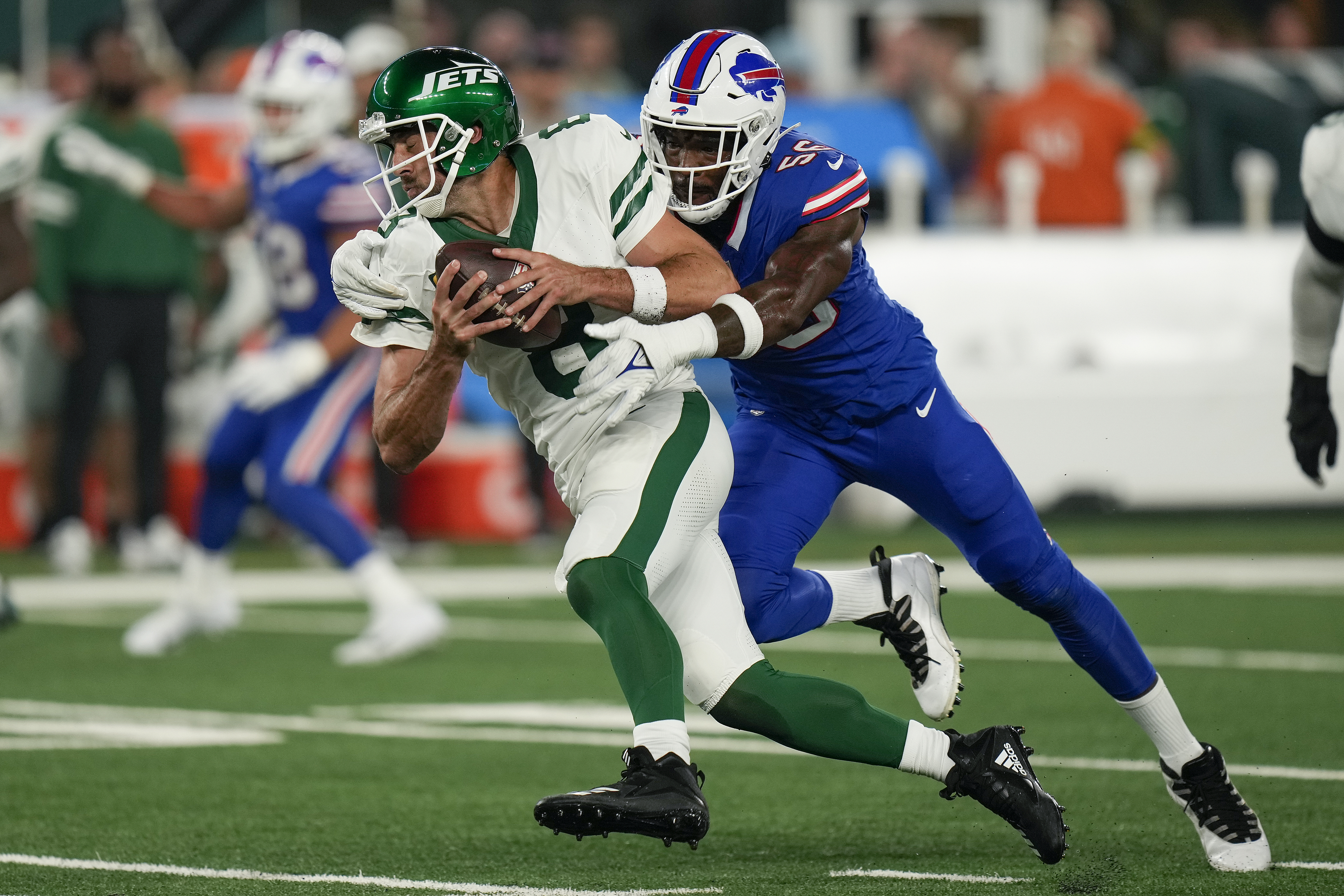 Green Bay, WI, USA. 30th Sep, 2018. Green Bay Packers quarterback Aaron  Rodgers #12 removes turf from his knee brace during the NFL Football game  between the Buffalo Bills and the Green