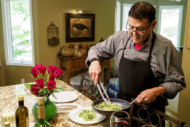 Staff file photo / Personal chef Jeffrey Martinez plates a dish of turkey meatballs and zucchini noodles on May 17, 2021, at his mother's home on Signal Mountain.