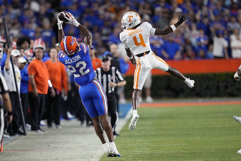 AP photo by John Raoux / Florida receiver Kahleil Jackson stays in bounds and makes a catch behind Tennessee defensive back Warren Burrell during the first half of Saturday's matchup of SEC East rivals in Gainesville, Fla.