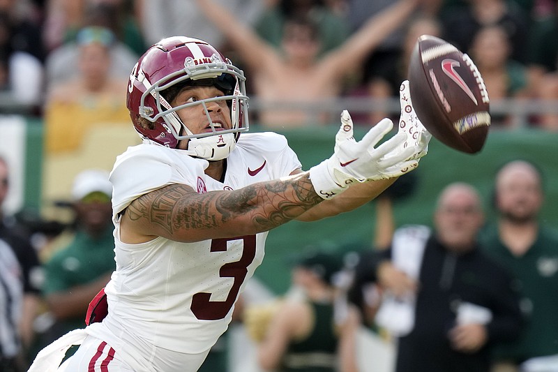 AP photo by Chris O'Meara / Alabama receiver Jermaine Burton can't catch a pass from quarterback Tyler Buchner during Saturday's game against South Florida in Tampa.