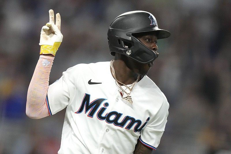AP photo by Lynne Sladky / The Miami Marlins' Jazz Chisholm Jr. holds up two fingers as he runs the bases after hitting a grand slam during the third inning of Sunday's home game against the Atlanta Braves. Chisholm hit a grand slam for the second straight day.