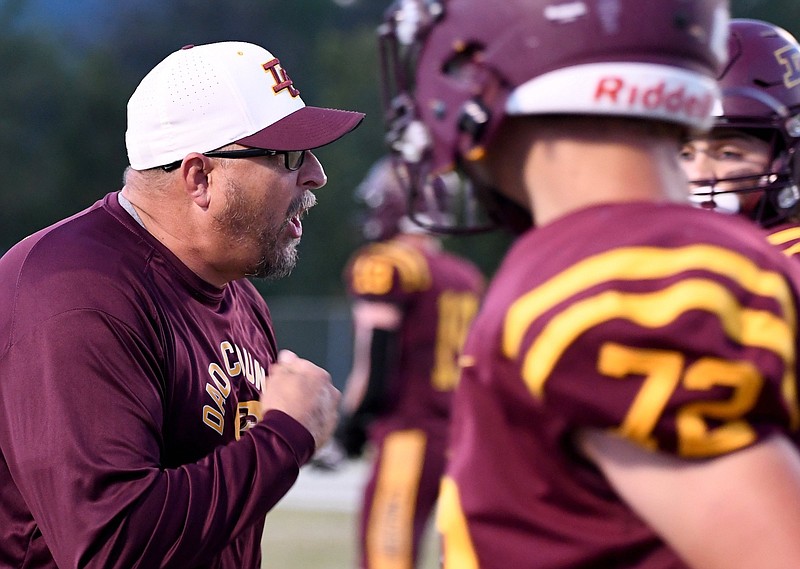 Staff file photo by Robin Rudd / Dade County football and wrestling coach Jeff Poston, left, hopes the GHSA's ongoing reclassification discussions will lead to a more "level playing field."