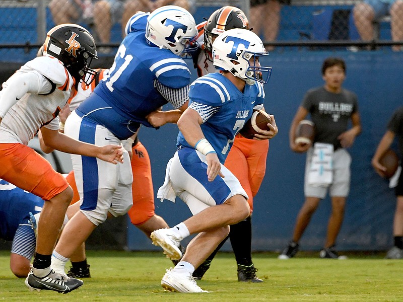 Staff file photo by Robin Rudd / Trion quarterback Kade Smith, with ball, had a pair of touchdown passes as the Bulldogs improved to 5-0 with a 28-21 win at Dade County on Friday night.