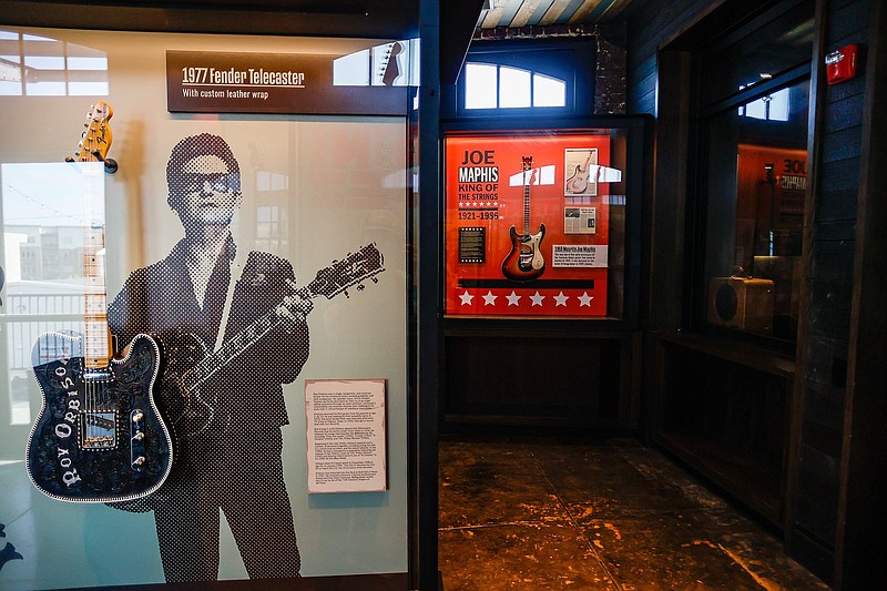Staff photo / Displays featuring guitar legends Roy Orbison and Joe Maphis and the instruments they were known for playing are seen at the Songbirds Guitar & Pop Culture Museum in 2021. The museum will move next year out of the terminal building at the Chattanooga Choo Choo into a new location in the 200 block of West Main Street.