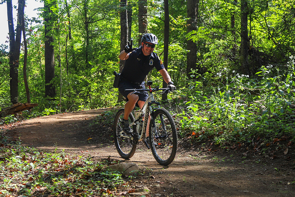 Staff photo by Olivia Ross / Cyclist riding along the new Aetna Trail
