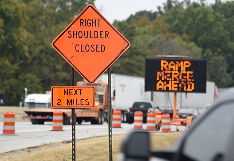 Staff photo by Matt Hamilton / Traffic slows around roadwork signs in the southbound lanes of Interstate 75 on Wednesday.
