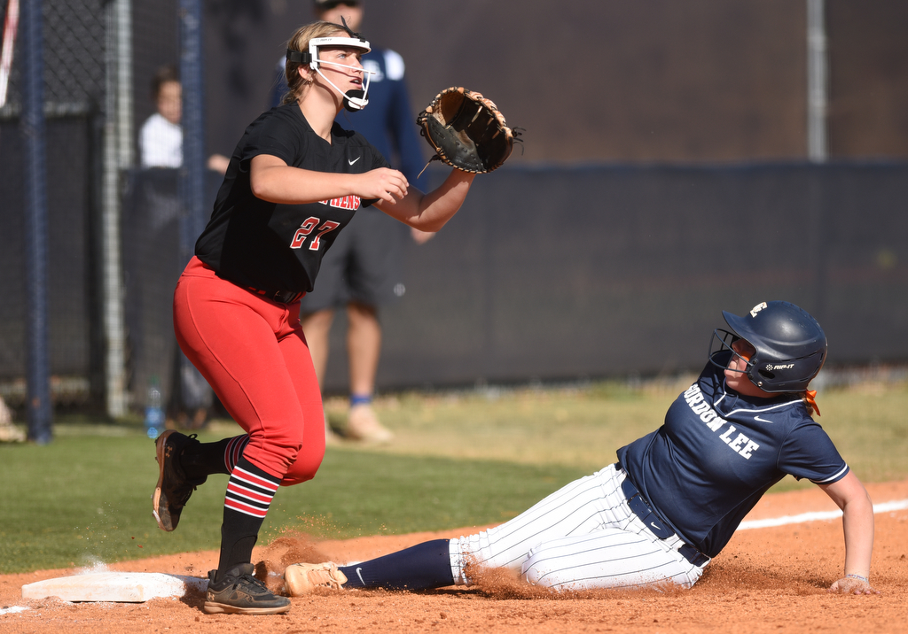Staff photo by Matt Hamilton/ Stephens County (27) Nyleigh Hutto cant get the ball in time to stop Gordon Lee (15) Lane Wilson as she takes third base at Gordon Lee on Tuesday, October 17, 2023. Gordon Lee went on to win the game, 15-0 in three innings by the mercy rule.