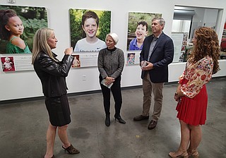Staff photo by Mike Pare / On Friday, Unum representatives toured the Austin Hatcher Foundation's headquarters and presented the nonprofit with a $175,000 check. From left are Amy Jo Osborn, the foundation's president and CEO; Liz Ahmed, Unum's executive vice president of people and communications; Unum CEO Rick McKenney; and Rachel Hargis, Unum manager of corporate social responsibility.