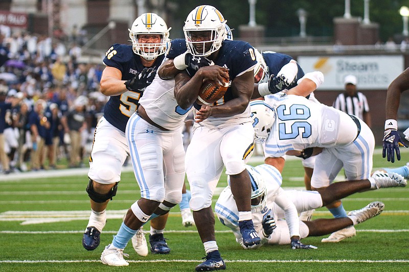 Staff photo by Olivia Ross / UTC senior running back Ailym Ford scores a touchdown during a home game against The Citadel on Sept. 16. The Mocs will be back at Finley Stadium for another SoCon game Saturday afternoon as rival East Tennessee State visits.