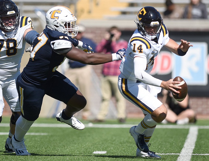 Staff photo by Matt Hamilton/ UTC defensive lineman Jamarr Jones flushes ETSU quarterback William Riddle out of the pocket during last Saturday's SoCon game at Finley Stadium. UTC sacked Riddle four times and pressured him eight times in all during a 34-3 win for the Mocs.