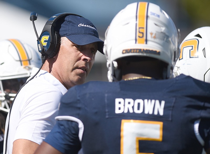 Staff photo by Matt Hamilton / UTC football coach Rusty Wright talks to linebacker Kameron Brown during last Saturday's game against East Tennessee State at Finley Stadium. The Mocs are on the road this week to face Virginia Military Institute.