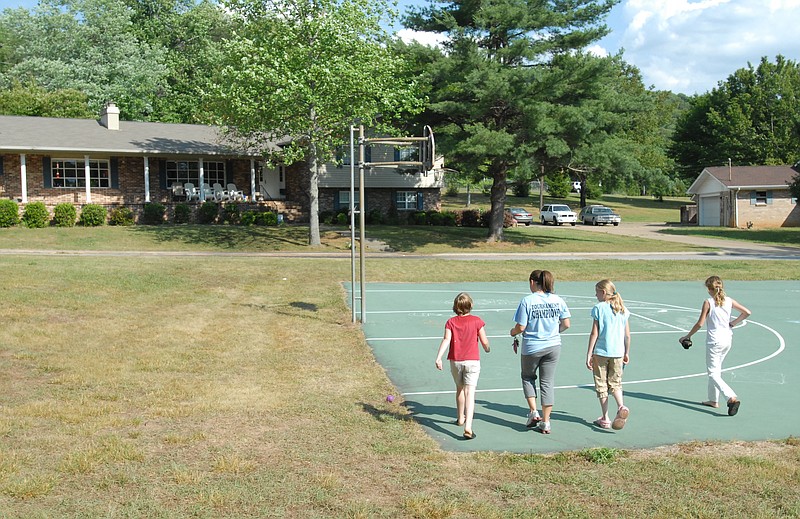 Staff file photo / Bethel children walk back to their home at Exchange Cottage on the campus of Bethel Bible Village.