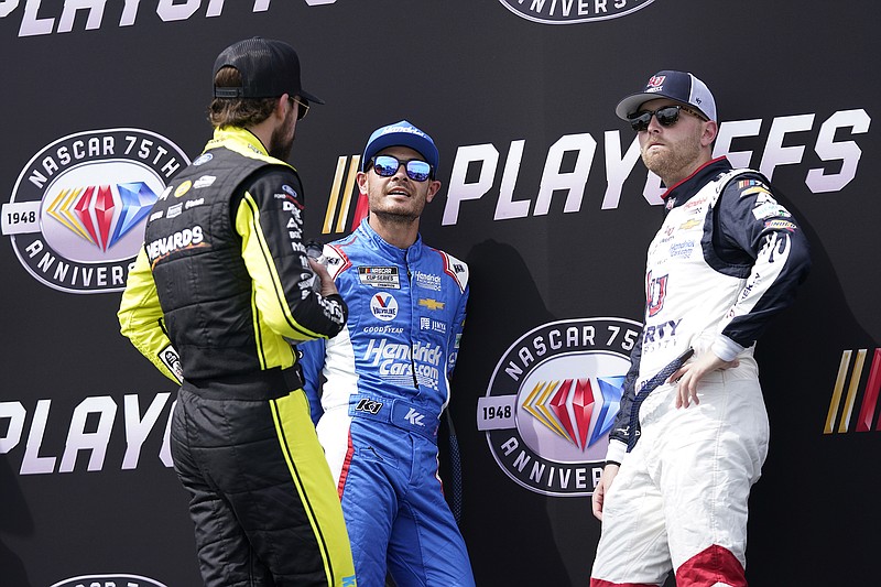 AP photo by Wilfredo Lee / From left, NASCAR drivers Ryan Blaney, Kyle Larson and William Byron chat as they wait backstage during driver introductions before the start of a Cup Series playoff race on Oct. 22 at Florida's Homestead-Miami Speedway.