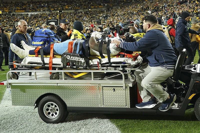 AP photo by Matt Freed / Tennessee Titans wide receiver Treylon Burks is carted off the field after getting injured during the second half of Thursday night's road game against the Pittsburgh Steelers.