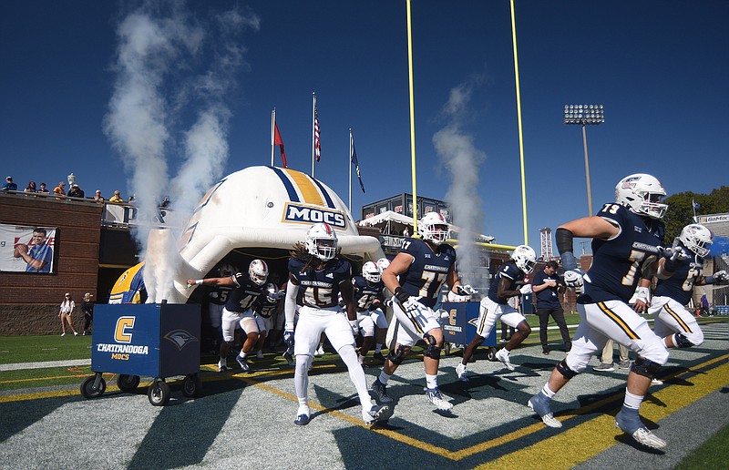 Staff photo by Matt Hamilton / UTC football players take the field for Saturday's game against Furman at Finley Stadium. The Mocs are off this week before visiting Alabama on Nov. 18, but they won't know until the following day whether they're included in the 24-team FCS playoffs.