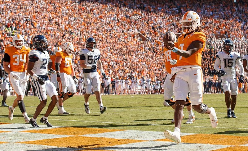 Tennessee Athletics photo / Tennessee sixth-year senior quarterback Joe Milton III, shown here scoring on a 6-yard touchdown run in Saturday's 59-3 shredding of Connecticut, has completed 82.4% of his passes the past two games.