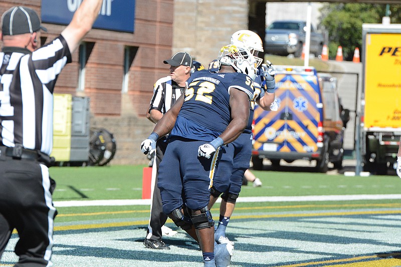 UTC Athletics photo by Laura O'Dell / UTC offensive lineman Almarion Crim celebrates after the Mocs scored a touchdown during their 34-3 home win against East Tennessee State on Oct. 21.