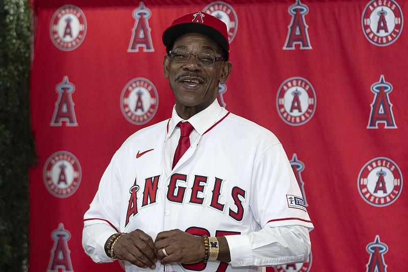 AP photo by Jae C. Hong / Ron Washington puts on his jersey during a news conference Wednesday in Anaheim, Calif., to introduce him as the newest manager of the Los Angeles Angels. The 71-year-old Washington, who was third base coach for the Atlanta Braves the past seven seasons, managed the Texas Rangers from 2007-14, winning two AL pennants and going 664–611.