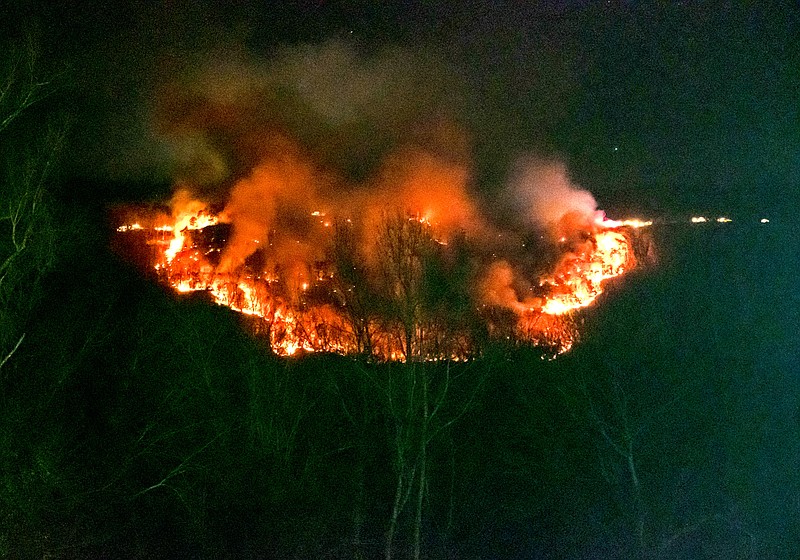 Contributed photo / Emergency vehicles can be seen lining the ridge above a wildfire on Whitwell Mountain in Marion County around 10:30 p.m. CST Sunday.