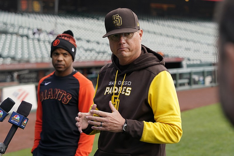FILE - Then-San Diego Padres third base coach Mike Shildt, right, speaks at a news conference next to San Francisco Giants first base coach Antoan Richardson before a baseball game in San Francisco on April 13, 2022. Shildt has been hired as manager of the San Diego Padres, returning to the dugout two years after he was suddenly fired by the St. Louis Cardinals following a third straight playoff appearance, a person with knowledge of the situation said Tuesday, Nov. 21, 2023. (AP Photo/Jeff Chiu, File)