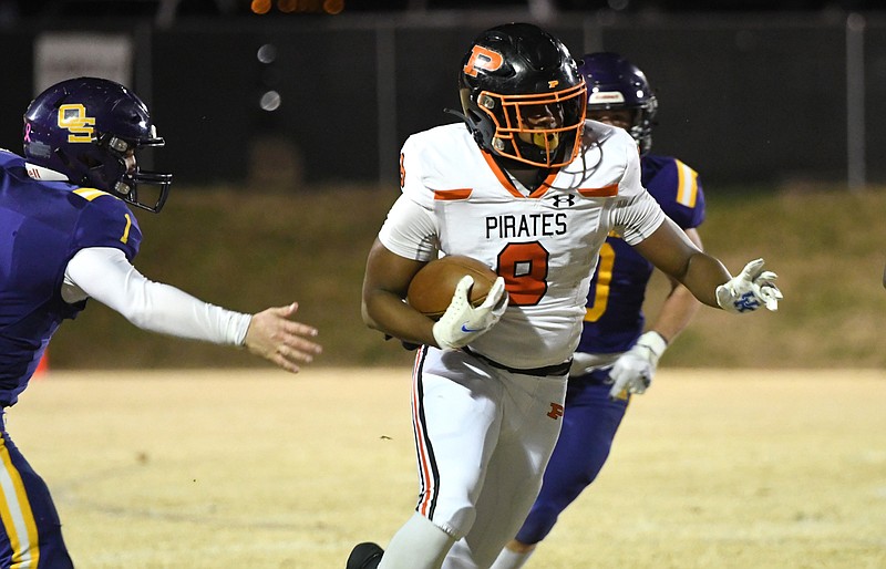 Staff photo by Robin Rudd / South Pittsburg's Jamarion Farrior breaks a long run during a TSSAA Class 1A semifinal Friday night at Oliver Springs. Farrior took over at quarterback after starter Kamden Wellington got injured early and had to leave the game.