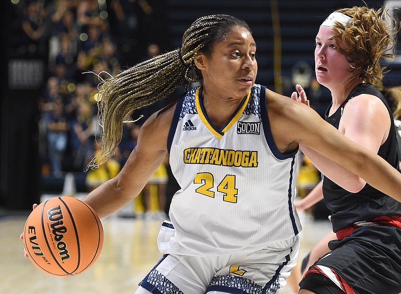 Staff photo by Matt Hamilton / UTC's Jada Guinn (24) drives past UVA Wise's Caitlyn Ross last Saturday at McKenzie Arena. On Friday night, Guinn scored a career-high 26 points to help the Mocs to a 64-54 win against Kent State in Daytona Beach, Fla.