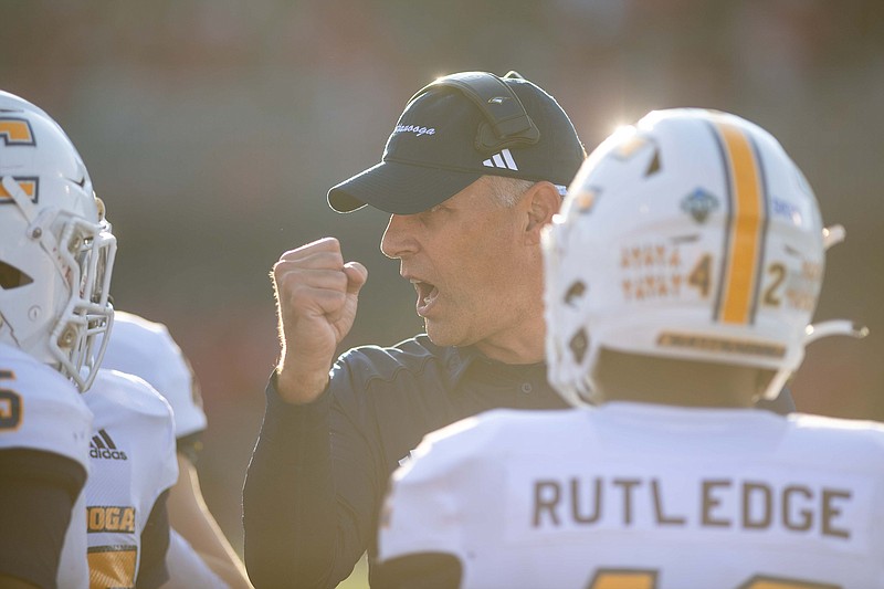 USA Today Network photo by Jamar Coach / UTC coach Rusty Wright talks to his players in a timeout huddle during the Mocs' game against Austin Peay in the first round of the FCS playoffs on Saturday in Clarksville, Tenn.