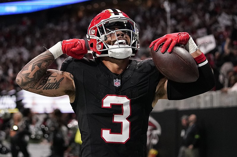 AP photo by Brynn Anderson / Atlanta Falcons safety Jessie Bates III celebrates after returning an interception 92 yards for a touchdown during Sunday's home win against the New Orleans Saints.