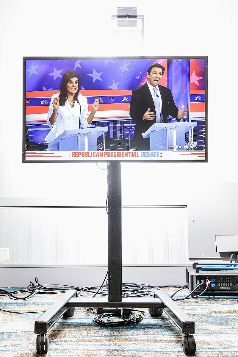 File photo/Damon Winter/The New York Times / A monitor shows an exchange between Nikki Haley and Ron DeSantis during the third Republican presidential primary debate in Miami on Nov. 8, 2023. It is time for the most promising of Donald Trumps challengers — who at this point appear to be DeSantis and Haley — to show us what they are made of, NYT columnist Michelle Cottle writes.