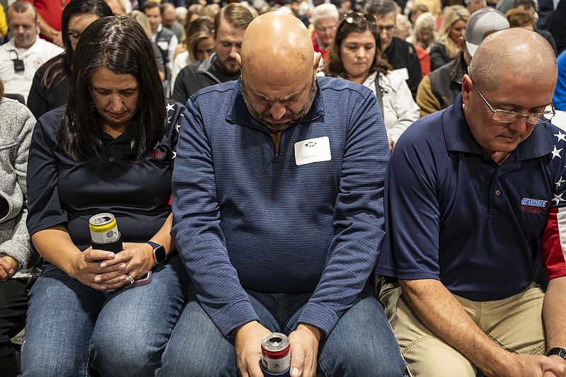 File photo/Jordan Gale/The New York Times / An opening prayer takes place in Iowa City, Iowa, on Friday, Oct. 20, 2023. A majority of evangelical voters in Iowa favor former President Donald J. Trump over GOP rival and Florida Gov. Ron DeSantis. But some say they fear Trump is backing off on abortion.