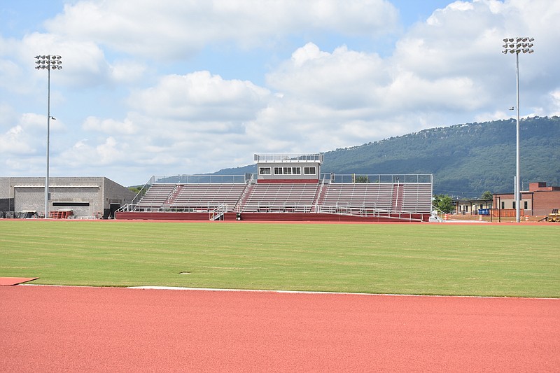 Staff File Photo By Patrick MacCoon / Turf is projected to replace the natural grass at The Howard School's relatively new football/track stadium, shown with Lookout Mountain in the background.